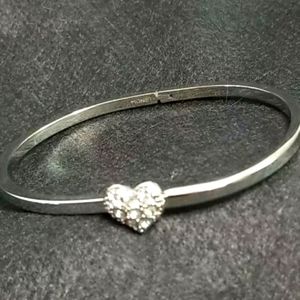Monet Bangle Bracelet Polished Silver Tone with Heart in crystal stones